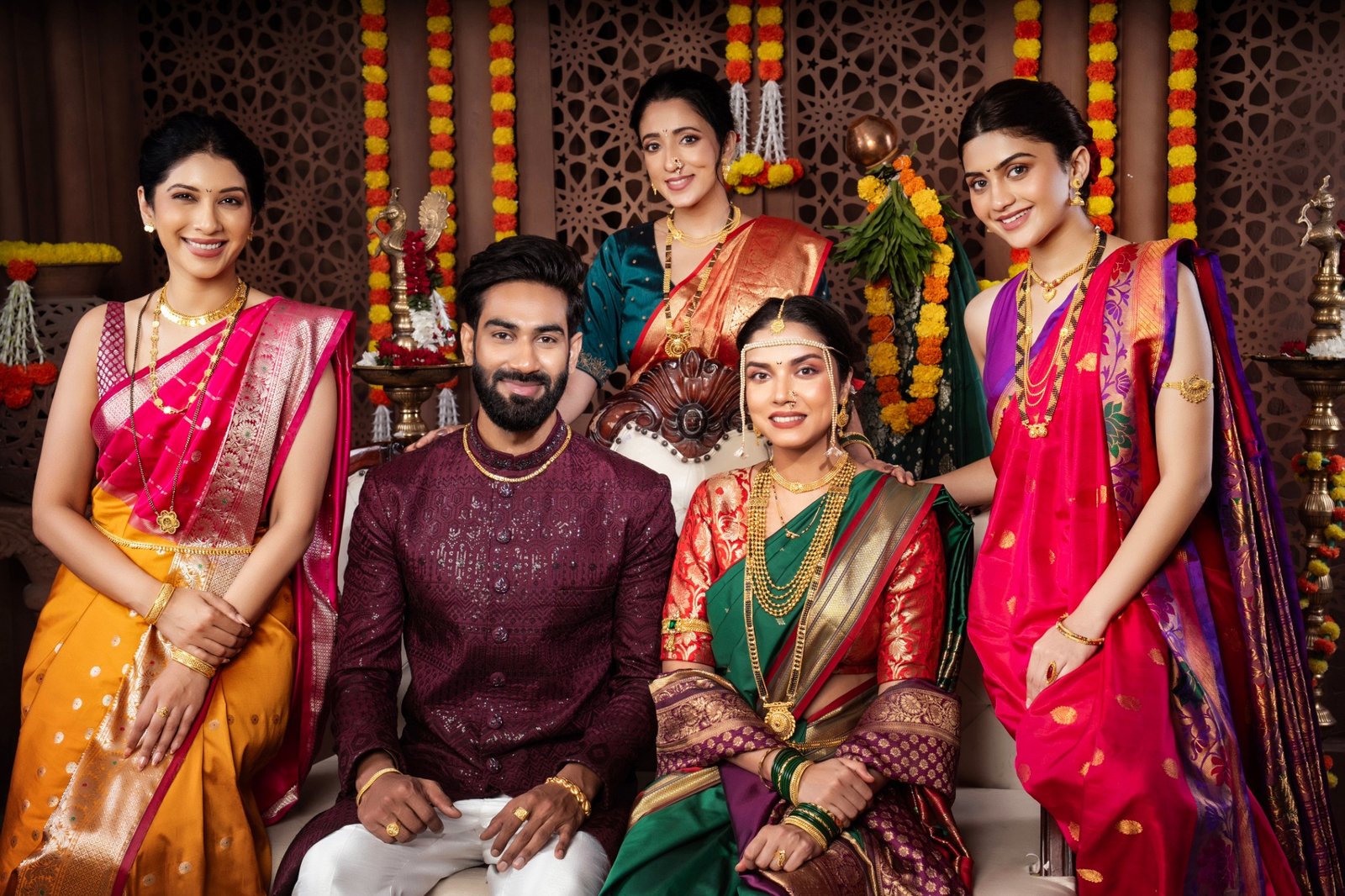 Maharashtrian family wearing traditional jewellery